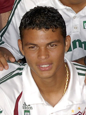Young Thiago Silva wearing a white Fluminense jersey during a team event in 2007.